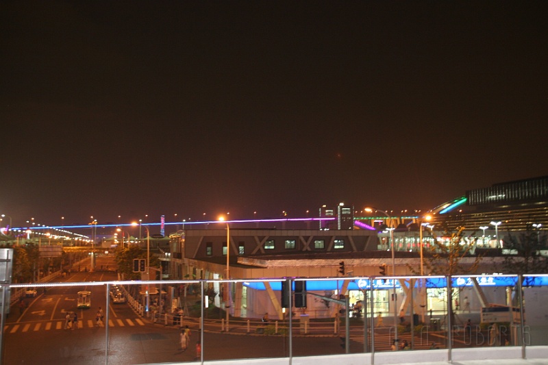 sh41.jpg - That blue/purple line of light in the middle of this shot is the elevated expressway in the distance.  Both sides of the structure are decorated in lights that chage color over time.