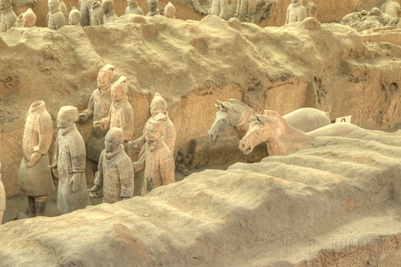 x23.jpg - That is why there are THOUSANDS of warriors still underground waiting for the day when China has the technology to unearth and protect them.  The wavy bits you see in this photo are the beams from the roof.