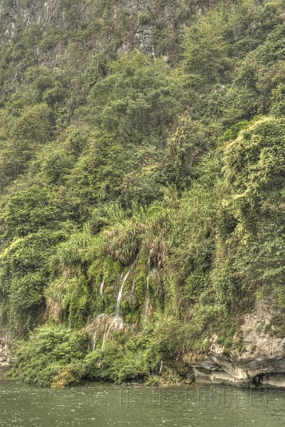 ys42.jpg - Some of the hills have waterfalls streaming down them like this one.