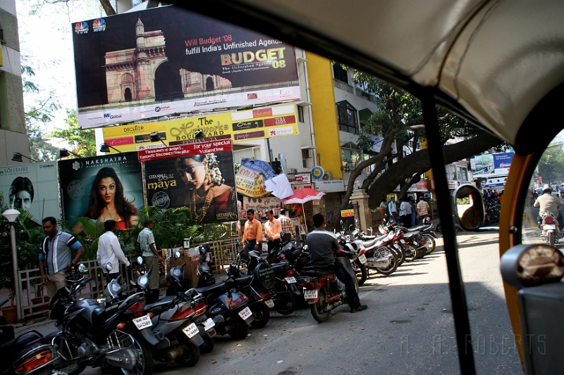 IMG_4792.JPG - Here I am tooling down the main drag in the back of an auto rickshaw.