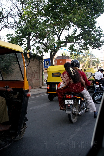 IMG_4829.JPG - Anything goes... except there's a helmet law.  Riding side saddle in a sari is cool.
