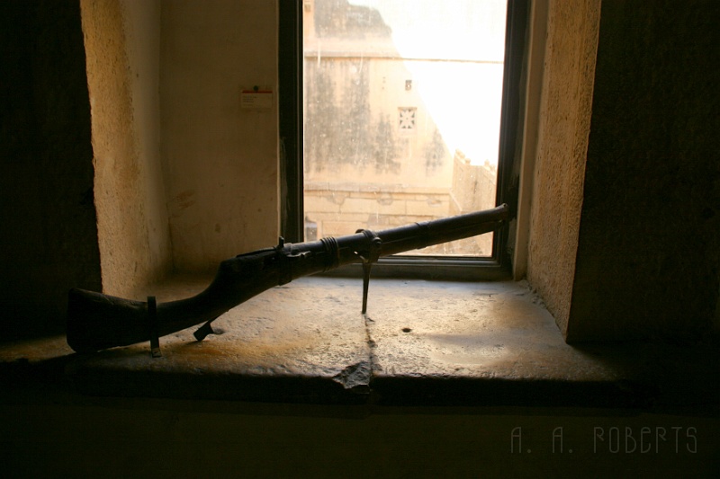 IMG_6247.JPG - There's a small arms display inside the palace.  Can you imagine trying to fire this thing!  It must have weighed like thirty pounds and they were a lot smaller back then!