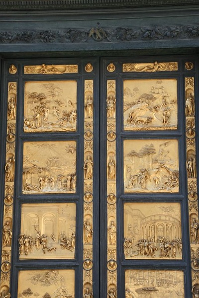 IMG_3810.jpg - I thought we'd open with a door... pun intended.  This is a replica of the original door on the Baptiserie that is outside the Duomo.  The original is kept in the Vatican or some place like that.  The door is covered in gold leaf and each panel depicts a scene from the bible.