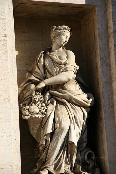 IMG_4047.jpg - This is a close up of one of the statues on the fountain.  Even in ancient times fruit baskets were a popular gift item.